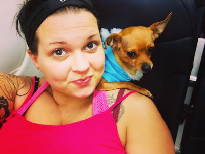 Sitting on mama's shoulders on the airplane